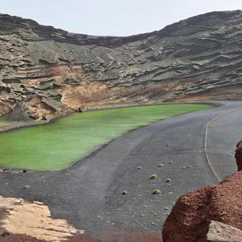 The green lagoon at El Golfo below its crater wall
