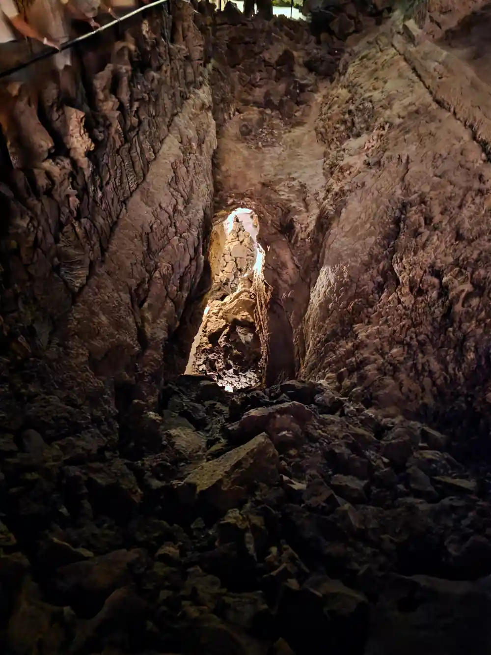 Underground lava tube tunnel opening to daylight