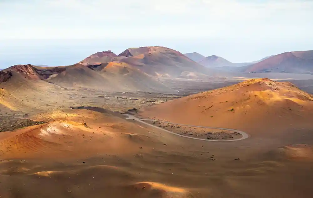 Volcanic landscape with orange and brown sand dunes
